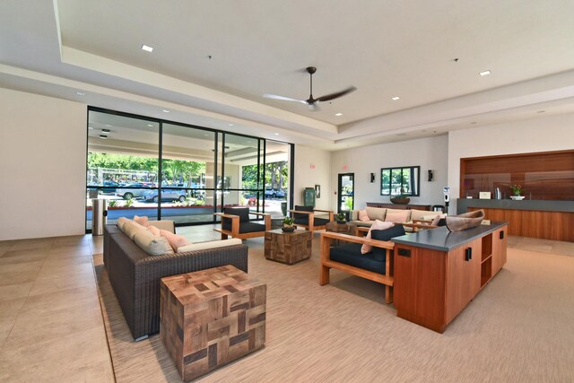 4327 Lower Honoapiilani Rd Unit 207B, Lahaina, HI 96761 - living room with a raised ceiling, ceiling fan, and a wall of windows