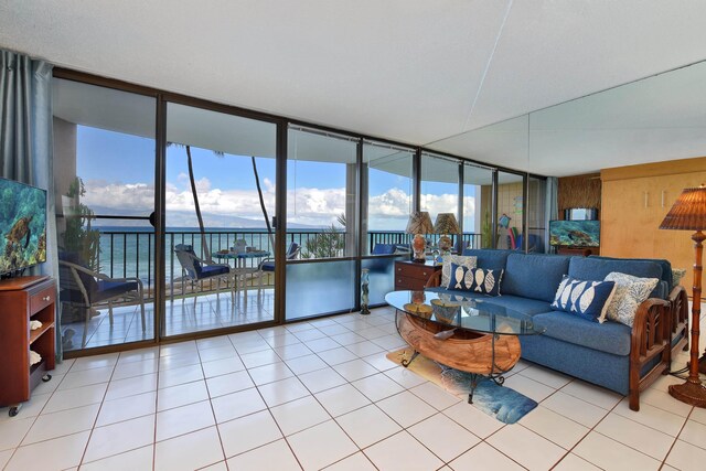 4327 Lower Honoapiilani Rd Unit 207B, Lahaina, HI 96761 - tiled living room featuring expansive windows
