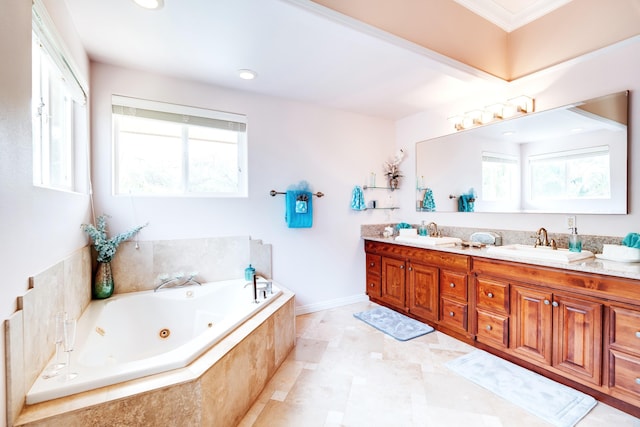 bathroom with vanity, a healthy amount of sunlight, a relaxing tiled tub, and ornamental molding