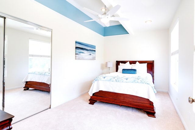 carpeted bedroom with ceiling fan