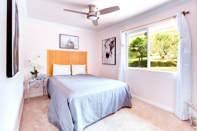 bedroom with ornamental molding, light carpet, and ceiling fan