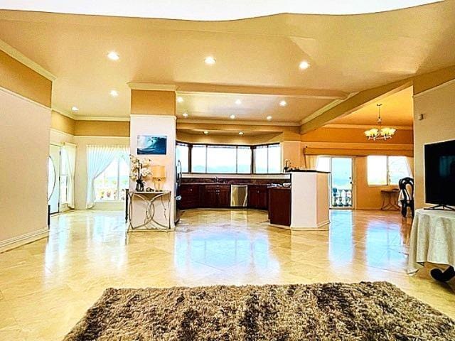 kitchen with hanging light fixtures, dark brown cabinetry, stainless steel appliances, crown molding, and an inviting chandelier