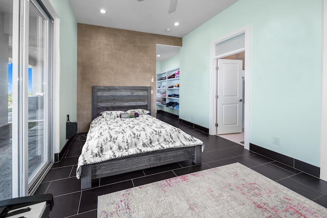 bedroom featuring dark tile patterned flooring and ceiling fan