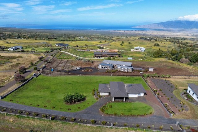 drone / aerial view featuring a mountain view and a rural view