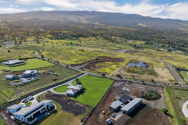 birds eye view of property featuring a mountain view