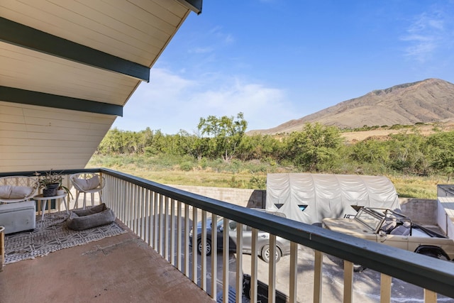 balcony featuring a mountain view