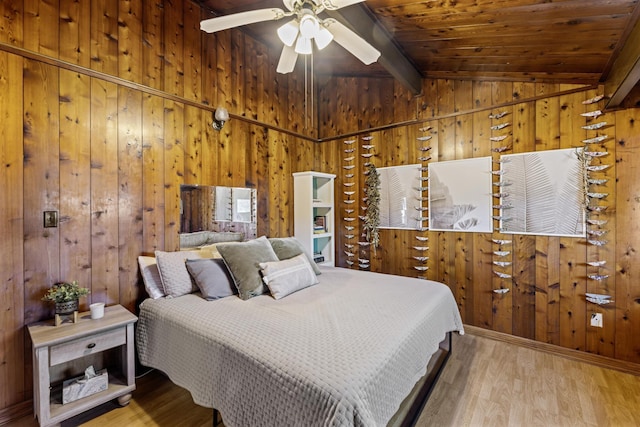 bedroom featuring wood ceiling, ceiling fan, wooden walls, wood-type flooring, and vaulted ceiling with beams