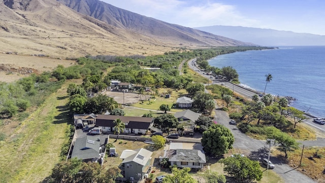 birds eye view of property featuring a water and mountain view