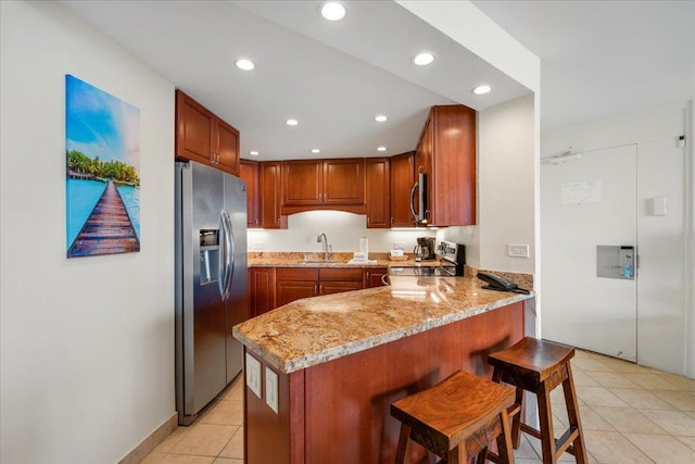 3445 Lower Honoapiilani Rd Unit 204, Lahaina, HI 96761 - kitchen featuring appliances with stainless steel finishes, a sink, light tile patterned flooring, a peninsula, and recessed lighting