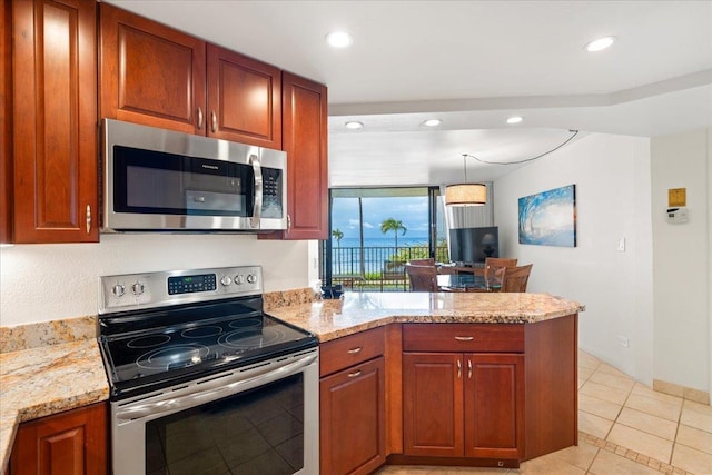 3445 Lower Honoapiilani Rd Unit 204, Lahaina, HI 96761 - kitchen featuring appliances with stainless steel finishes, a peninsula, light stone countertops, light tile patterned floors, and recessed lighting