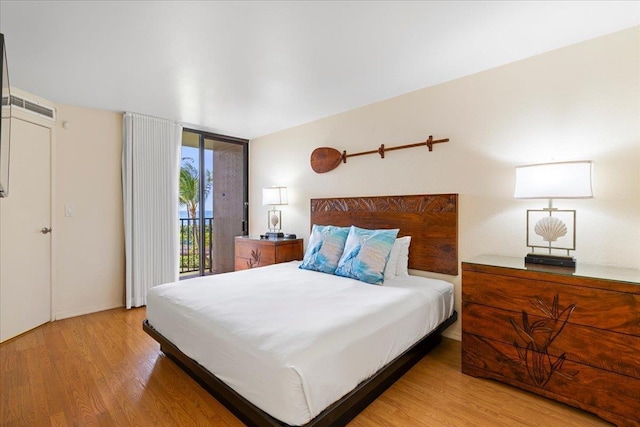3445 Lower Honoapiilani Rd Unit 204, Lahaina, HI 96761 - bedroom with access to outside and light wood-style flooring