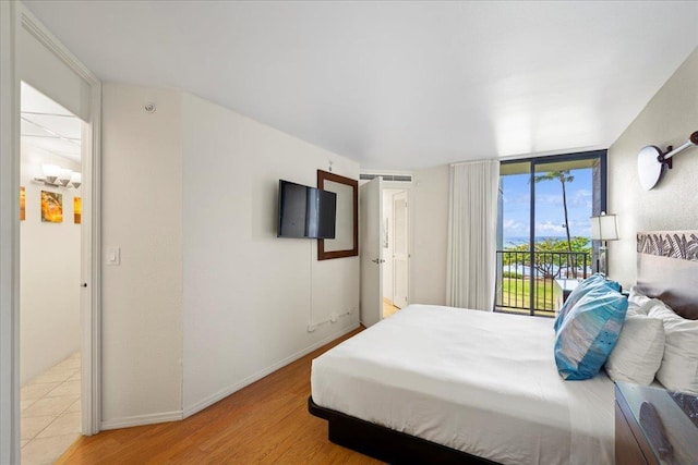3445 Lower Honoapiilani Rd Unit 204, Lahaina, HI 96761 - bedroom with access to outside and light wood finished floors