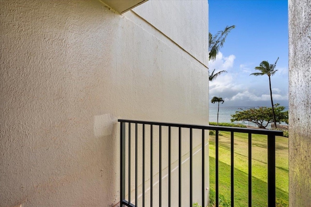 3445 Lower Honoapiilani Rd Unit 204, Lahaina, HI 96761 - exterior space with stucco siding, a balcony, a water view, and a yard