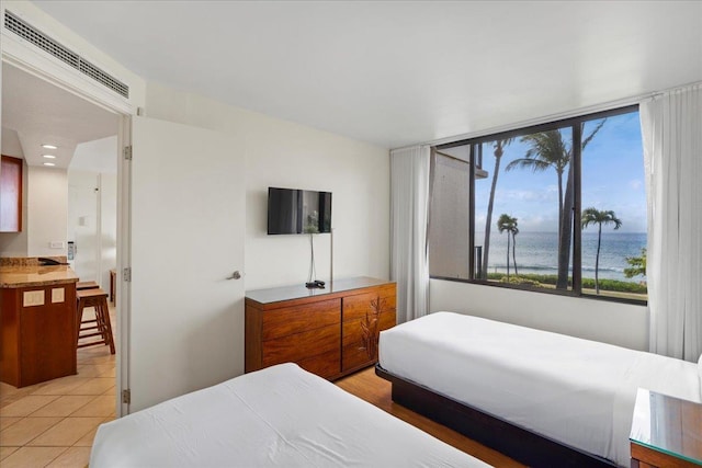 3445 Lower Honoapiilani Rd Unit 204, Lahaina, HI 96761 - bedroom featuring multiple windows and light tile patterned floors
