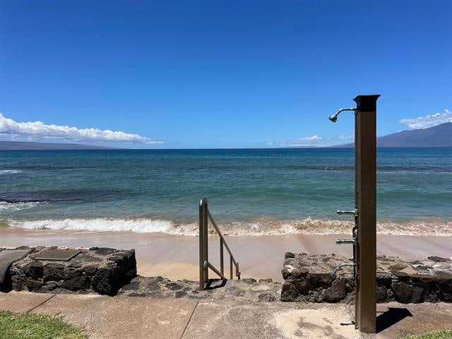 property view of water featuring a beach view