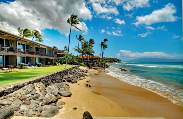 view of nearby features with a water view and a view of the beach