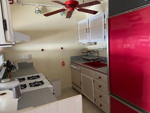 kitchen with built in fridge, white cabinets, light tile floors, dishwasher, and ceiling fan