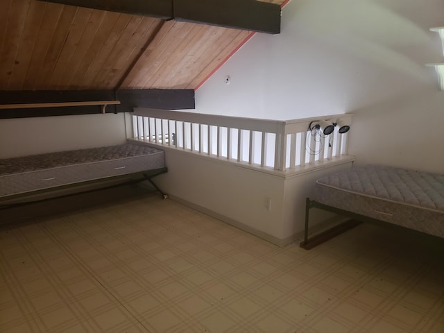 bonus room with wood ceiling, light tile floors, and lofted ceiling