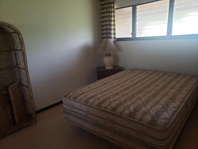 bedroom featuring dark wood-type flooring