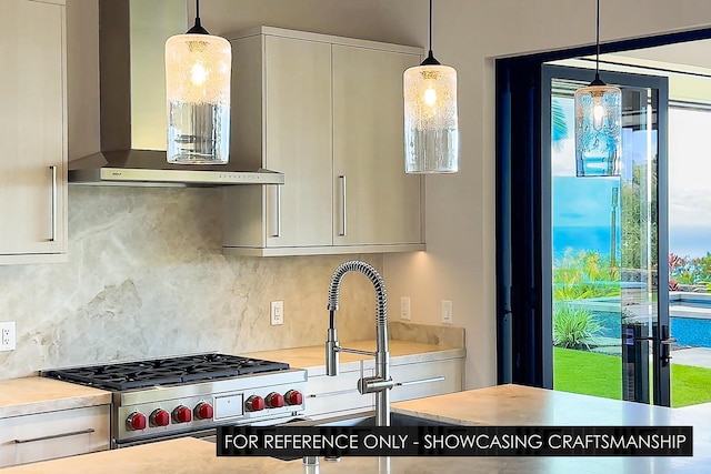 kitchen with wall chimney range hood, decorative backsplash, high end stove, light countertops, and pendant lighting