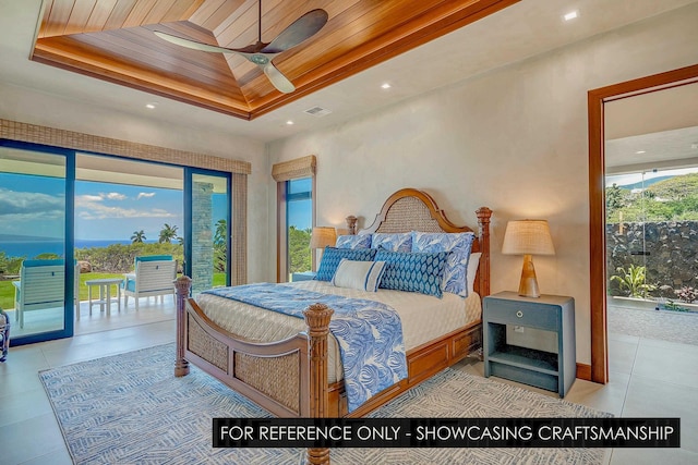 bedroom with a tray ceiling, access to outside, light tile patterned floors, and ceiling fan