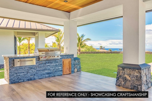 view of patio / terrace featuring exterior kitchen and area for grilling
