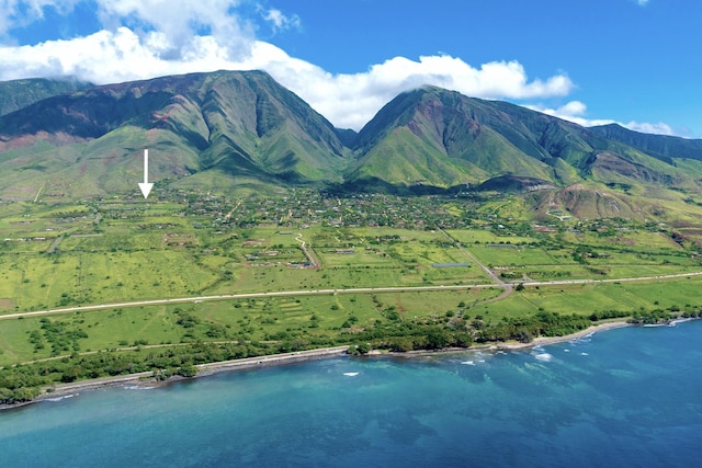 view of mountain background with a nearby body of water