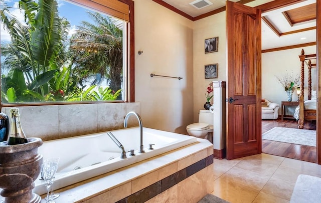 bathroom with toilet, tiled bath, tile patterned flooring, and crown molding