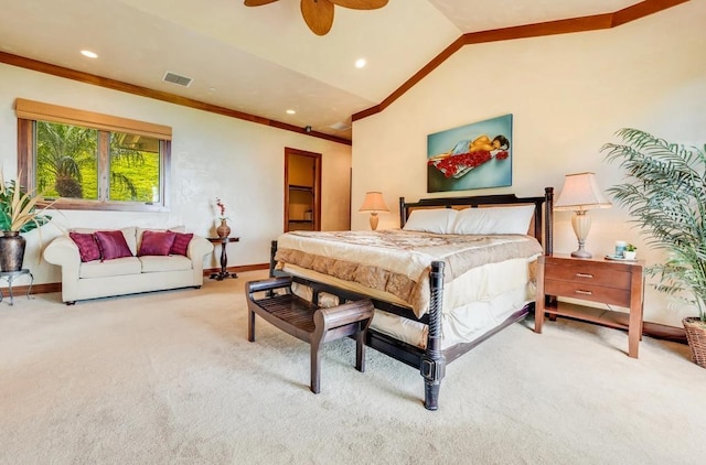 bedroom featuring ceiling fan, ornamental molding, lofted ceiling, and carpet floors