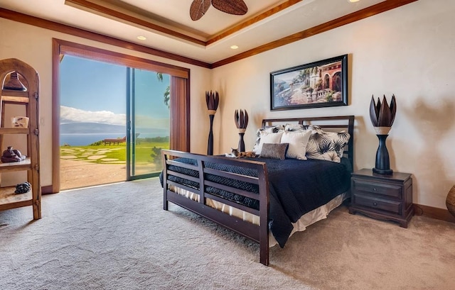 carpeted bedroom featuring ceiling fan, crown molding, a raised ceiling, and access to outside