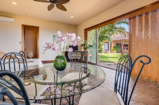 dining room with ceiling fan and a wall mounted air conditioner