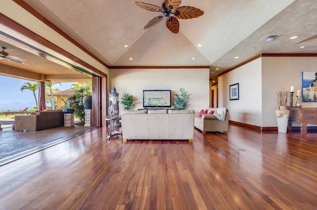 living room featuring ceiling fan, dark wood-type flooring, crown molding, and lofted ceiling