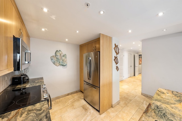 110 Kaanapali Shores Pl Unit 109, Lahaina, HI 96761 - kitchen with stainless steel appliances, recessed lighting, brown cabinets, modern cabinets, and light tile patterned floors