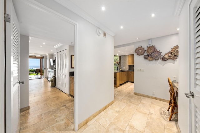 110 Kaanapali Shores Pl Unit 109, Lahaina, HI 96761 - corridor featuring plenty of natural light, recessed lighting, and ornamental molding