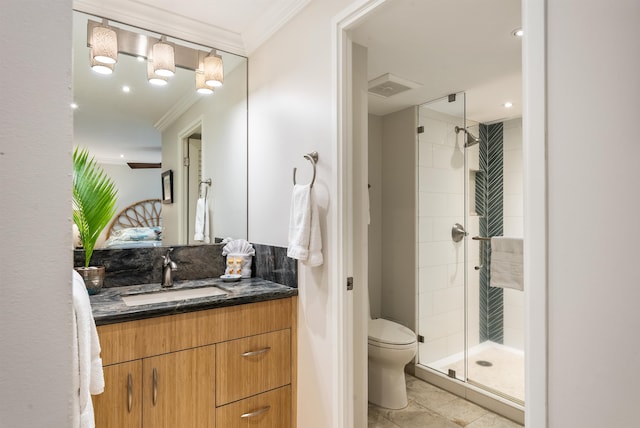 bathroom with walk in shower, toilet, vanity, crown molding, and tile patterned floors