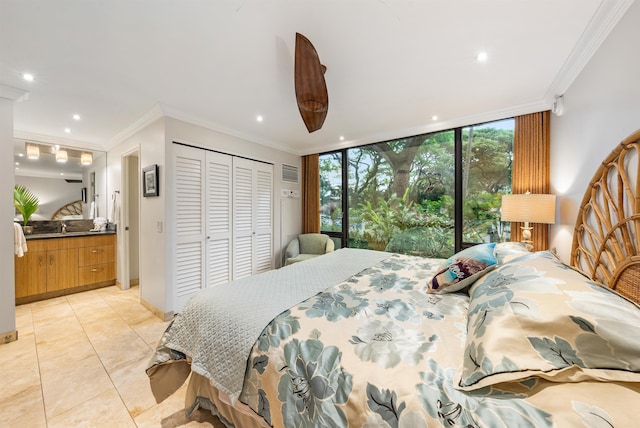 bedroom with light tile patterned floors, access to outside, crown molding, a closet, and sink