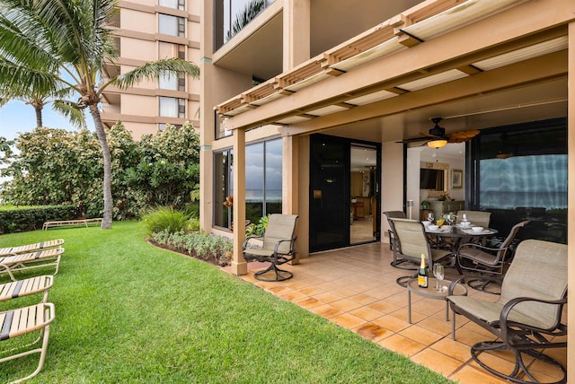 view of patio featuring ceiling fan