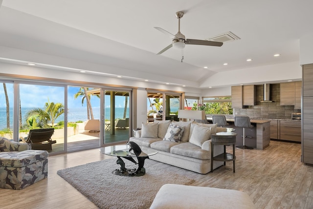 2274 S Kihei Rd, Kihei, HI 96753 - living area featuring a water view, recessed lighting, light wood finished floors, vaulted ceiling, and a ceiling fan