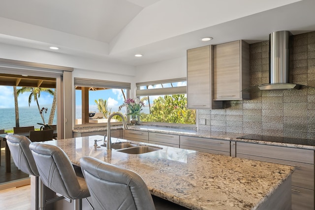 2274 S Kihei Rd, Kihei, HI 96753 - kitchen featuring wall chimney range hood, black electric stovetop, light stone countertops, recessed lighting, and lofted ceiling