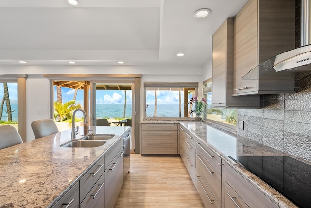 2274 S Kihei Rd, Kihei, HI 96753 - kitchen with black electric cooktop, recessed lighting, light wood-type flooring, backsplash, and light stone counters