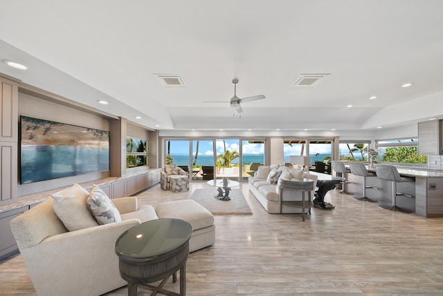 2274 S Kihei Rd, Kihei, HI 96753 - living area with light wood-style flooring, recessed lighting, a tray ceiling, and a ceiling fan