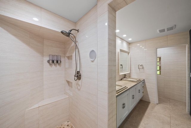 2274 S Kihei Rd, Kihei, HI 96753 - full bathroom with a tile shower, double vanity, tile walls, tile patterned flooring, and recessed lighting