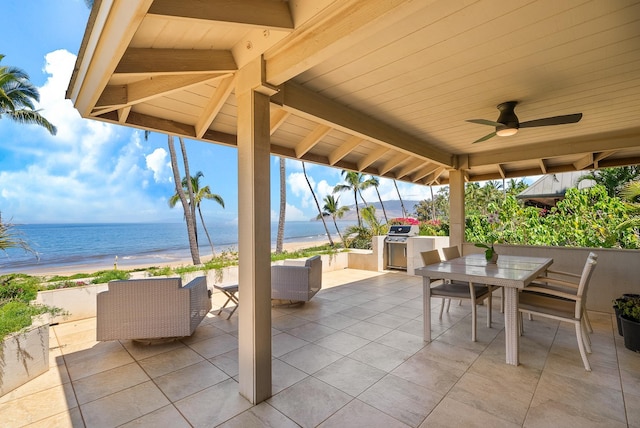 2274 S Kihei Rd, Kihei, HI 96753 - view of patio with an outdoor kitchen, view of water and beach, outdoor dining area, and ceiling fan