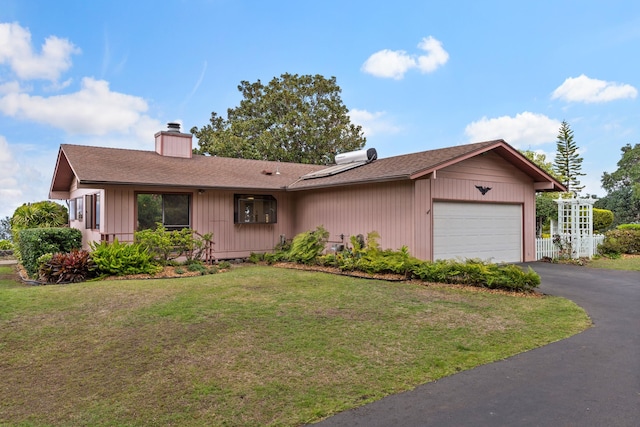 single story home with a front lawn and a garage