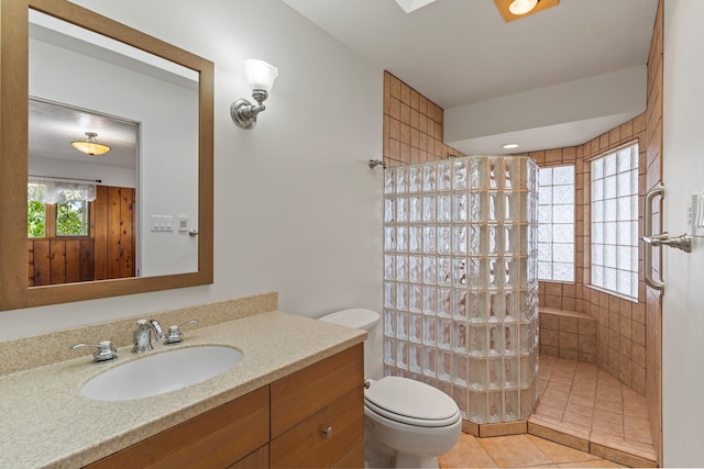 bathroom with vanity, toilet, and tile patterned flooring