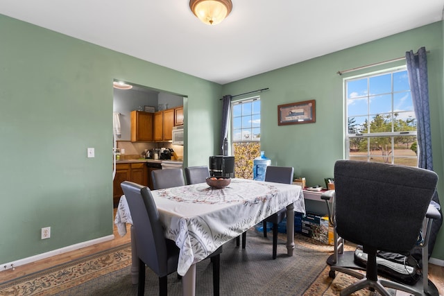 dining space featuring hardwood / wood-style flooring