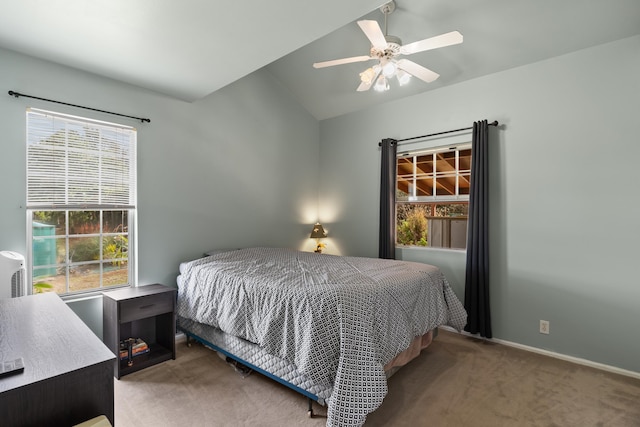 carpeted bedroom featuring lofted ceiling and ceiling fan