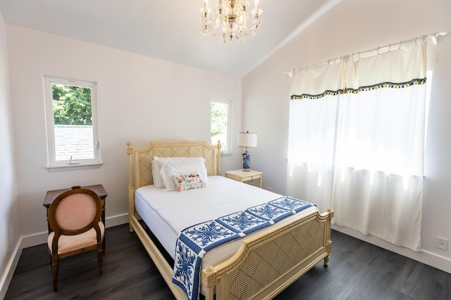 bedroom with lofted ceiling, multiple windows, and dark wood finished floors