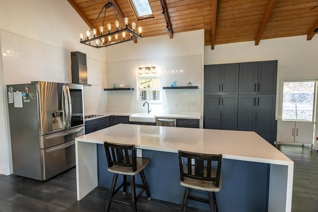 kitchen featuring wooden ceiling, dark wood-style flooring, stainless steel appliances, wall chimney range hood, and open shelves