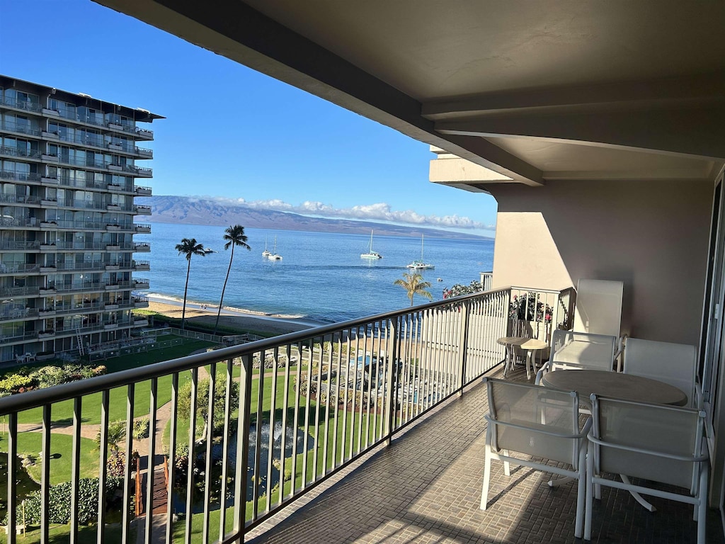 balcony featuring a water view